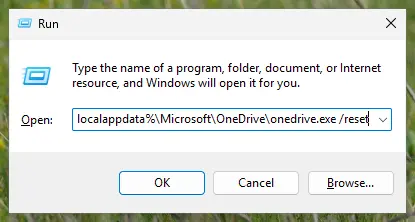 The Run box with the OneDrive reset command typed in the Open field