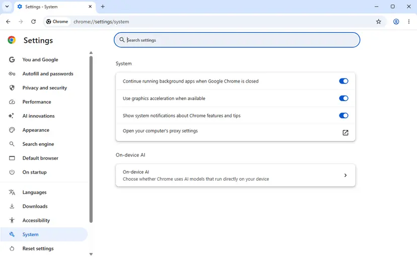 Chrome Settings System page with the row Open your computer's proxy settings and its external link icon
