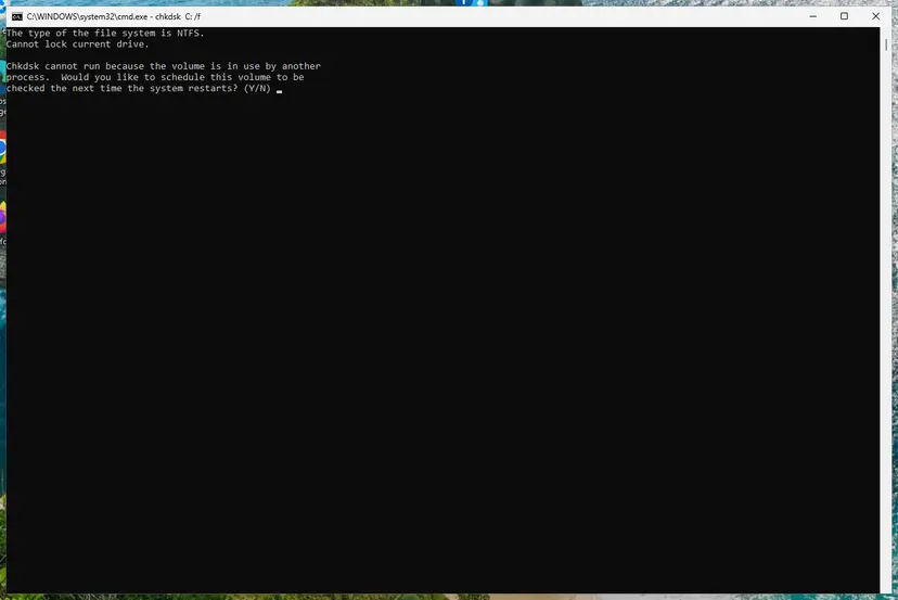 Chkdsk cannot run because the volume is in use by another process, schedule at restart (Y/N): screenshot taken on Windows 11 26H2