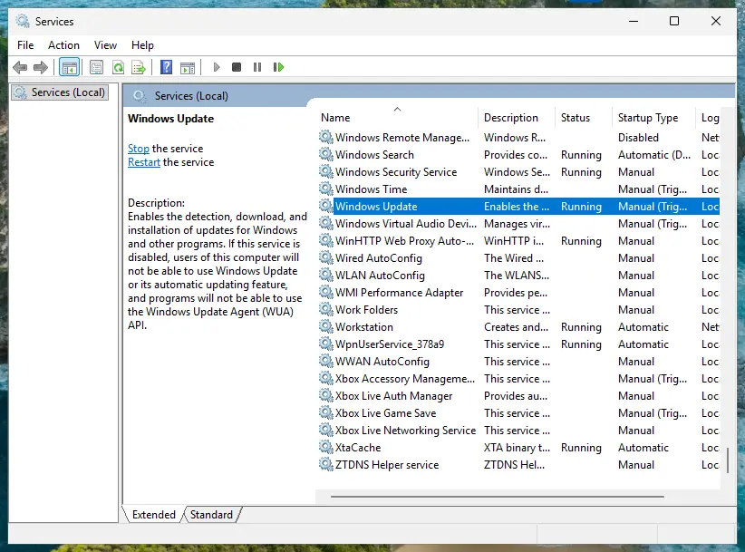 Services window with Windows Update selected, status Running, startup type Manual (Trigger Start): screenshot taken on Windows 11 26H2