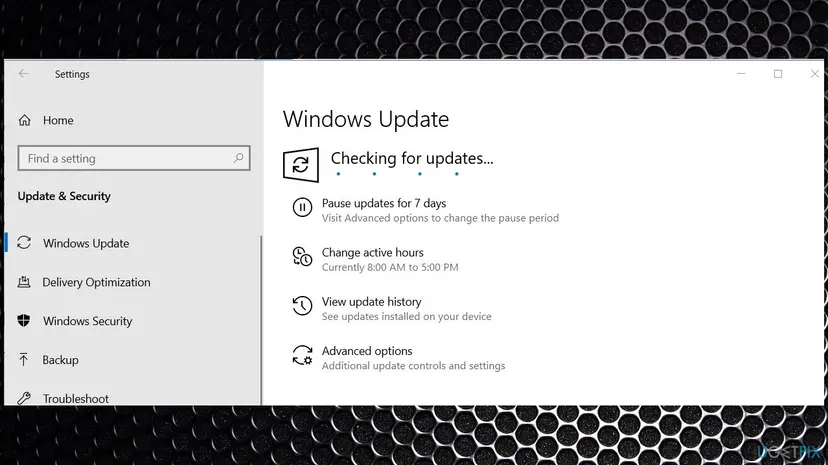 Windows 10 Settings on the Windows Update page while it checks for updates, with Pause updates, View update history and Advanced options