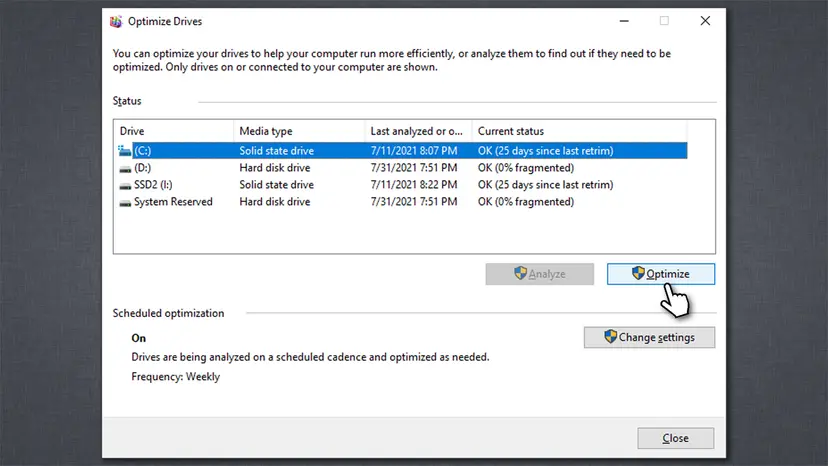 Optimize Drives window listing drive C: as a solid state drive and drive D: as a hard disk drive, with the Optimize button selected