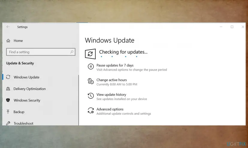 Windows 10 Settings Update and Security page with Windows Update checking for updates